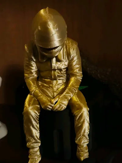 Sad F1 Driver Sitting on a ledge Figurine!