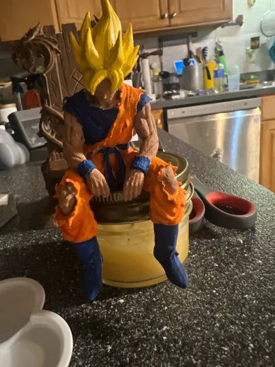 Sad Goku Figurine Sitting on a ledge!