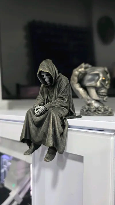 Sad Grim Reaper sitting on a ledge Figurine!
