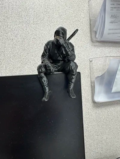 Sad Ninja sitting on a ledge Figurine!