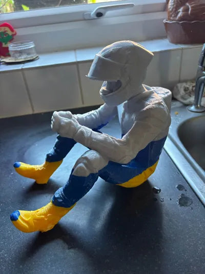 Sad MotoGP Rider on a ledge Figurine!