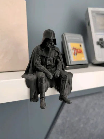 Sad Darth Vader sitting on a ledge figurine!