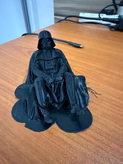 Sad Darth Vader sitting on a ledge figurine!