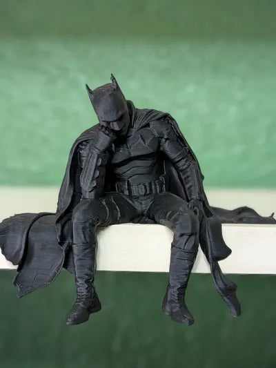 Sad Batman sitting on a Ledge Figurine!