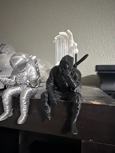 Sad Ninja sitting on a ledge Figurine!