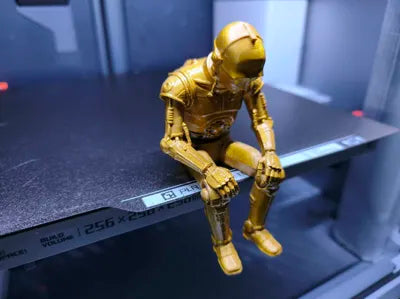 Sad C-3PO Star Wars Figurine sitting on a ledge!