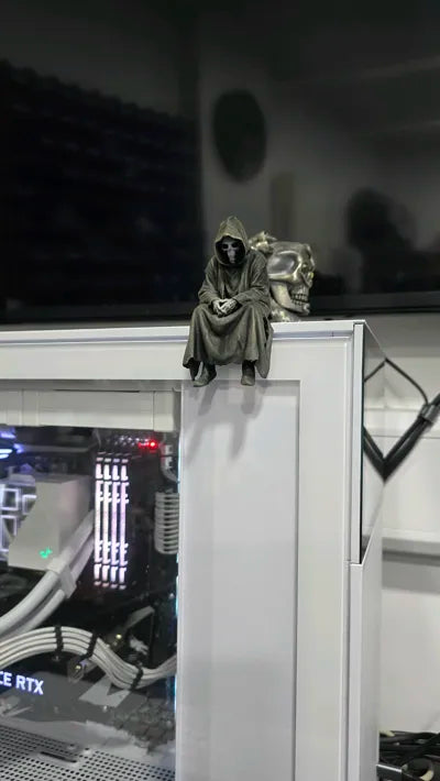 Sad Grim Reaper sitting on a ledge Figurine!