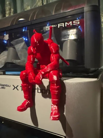 Sad Deadpool sitting on a ledge Figurine!