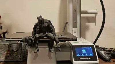 Sad Batman sitting on a Ledge Figurine!
