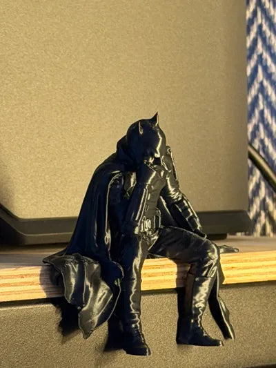 Sad Batman sitting on a Ledge Figurine!