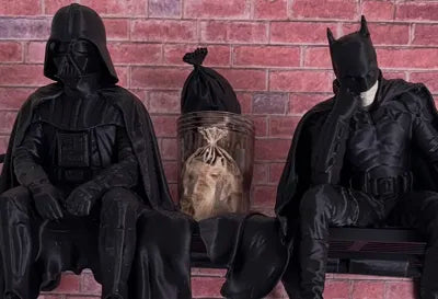Sad Batman sitting on a Ledge Figurine!