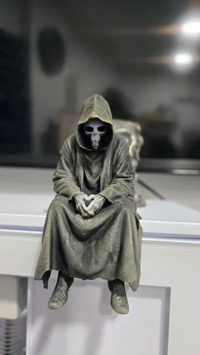 Sad Grim Reaper sitting on a ledge Figurine!