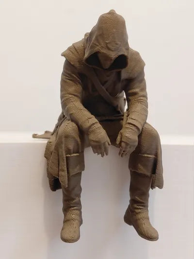 Sad Assassin's Creed sitting on a ledge Figurine