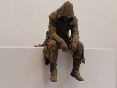 Sad Assassin's Creed sitting on a ledge Figurine