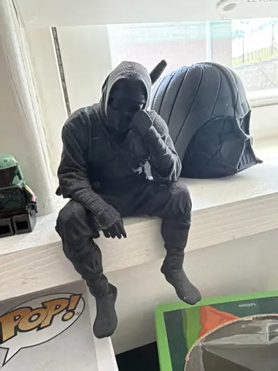 Sad Ninja sitting on a ledge Figurine!