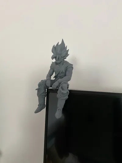 Sad Goku Figurine Sitting on a ledge!