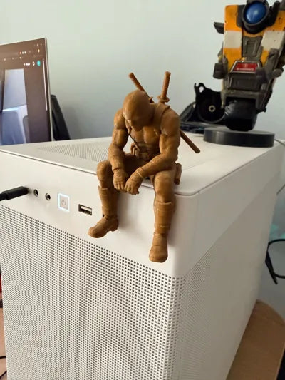 Sad Deadpool sitting on a ledge Figurine!