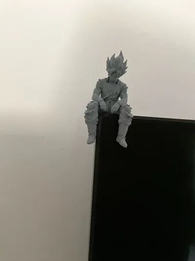 Sad Goku Figurine Sitting on a ledge!