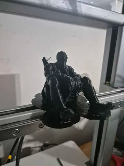 Sad Deadpool sitting on a ledge Figurine!