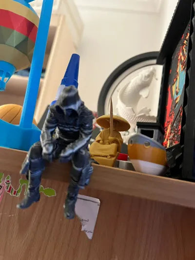 Sad Assassin's Creed sitting on a ledge Figurine
