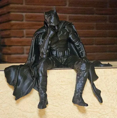 Sad Batman sitting on a Ledge Figurine!