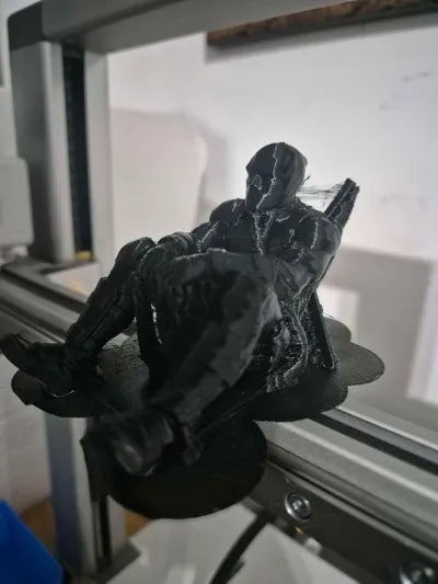 Sad Deadpool sitting on a ledge Figurine!