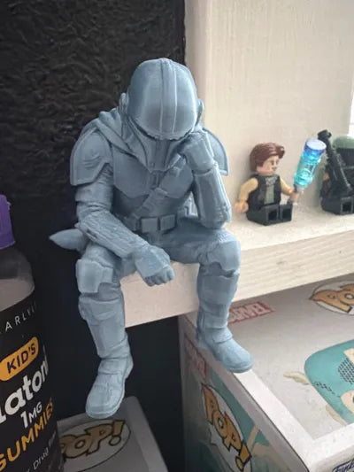 Sad Mandalorian on a ledge Figurine!