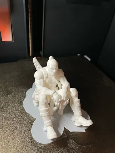 Sad Deadpool sitting on a ledge Figurine!