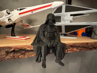 Sad Darth Vader sitting on a ledge figurine!