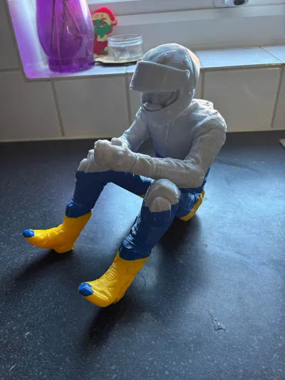 Sad MotoGP Rider on a ledge Figurine!