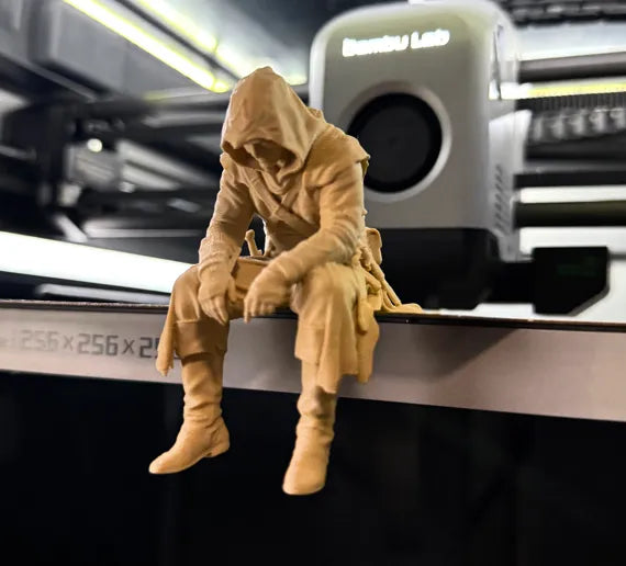 Sad Assassin's Creed sitting on a ledge Figurine