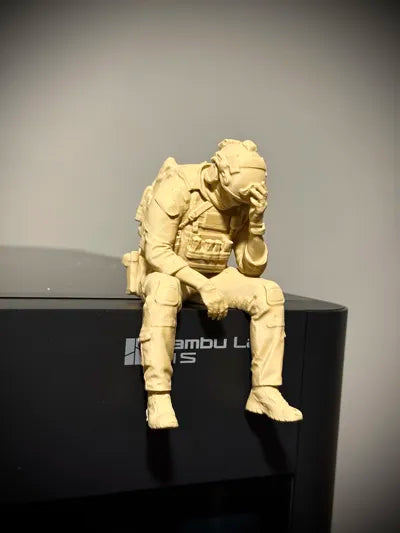 Sad Soldier sitting on a ledge Figurine!