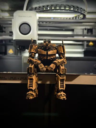 Sad Optimus Prime sitting on a ledge figurine!