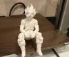 Sad Goku Figurine Sitting on a ledge!