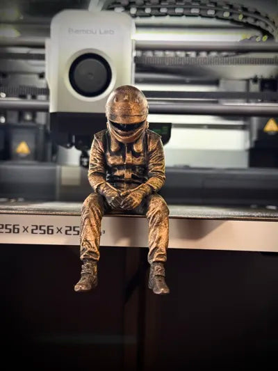 Sad F1 Driver Sitting on a ledge Figurine!