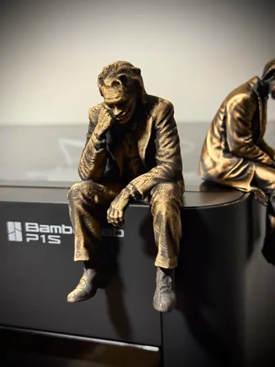 Sad Joker Figurine sitting on a ledge!