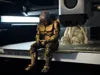 Sad RoboCop figurine sitting on a ledge!