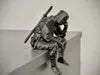 Sad Ninja sitting on a ledge Figurine!