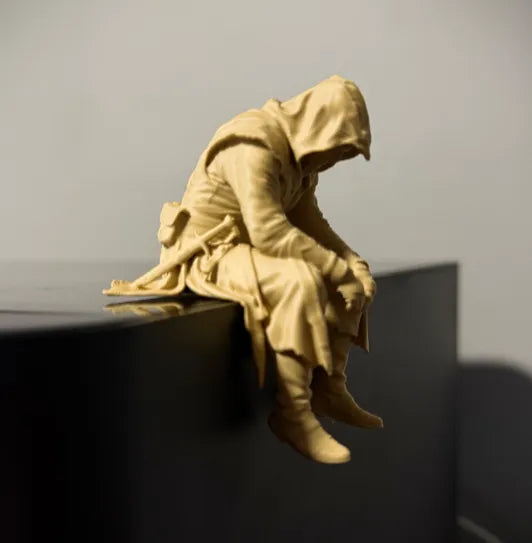 Sad Assassin's Creed sitting on a ledge Figurine