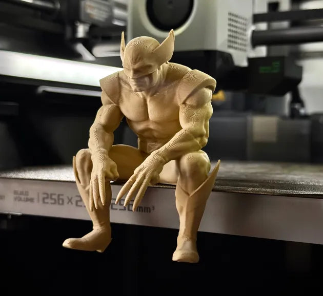 Sad Wolverine sitting on a ledge figurine!