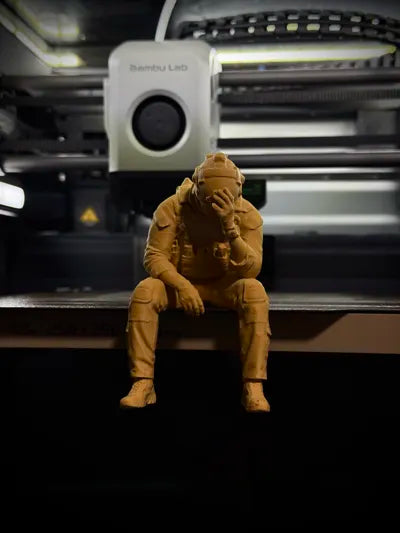 Sad Soldier sitting on a ledge Figurine!