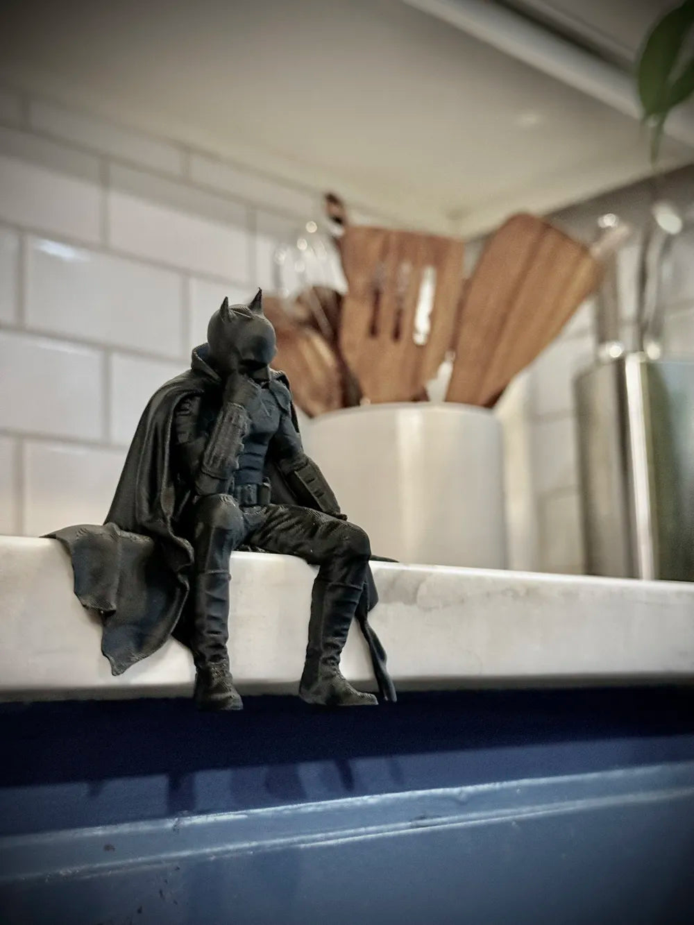 Sad Batman sitting on a Ledge Figurine!