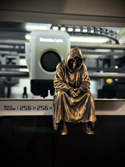 Sad Grim Reaper sitting on a ledge Figurine!