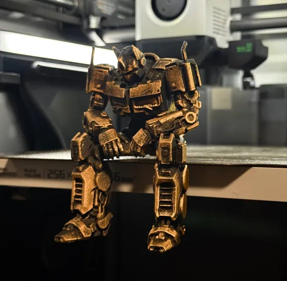 Sad Optimus Prime sitting on a ledge figurine!