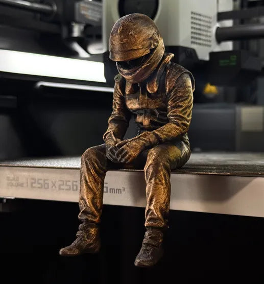 Sad F1 Driver Sitting on a ledge Figurine!