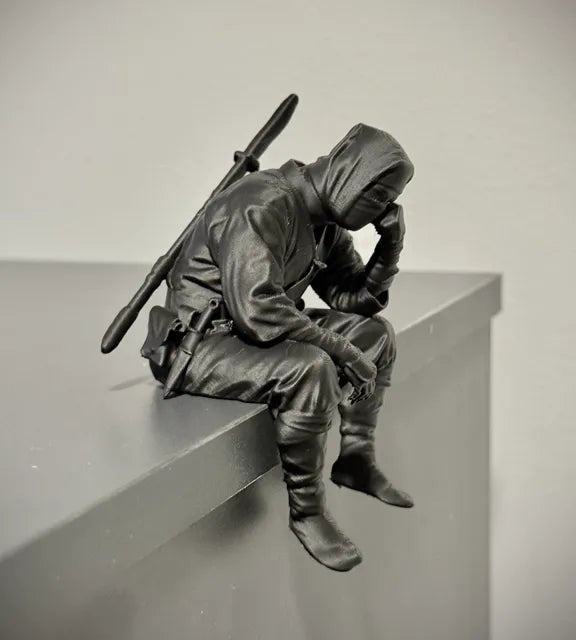Sad Ninja sitting on a ledge Figurine!