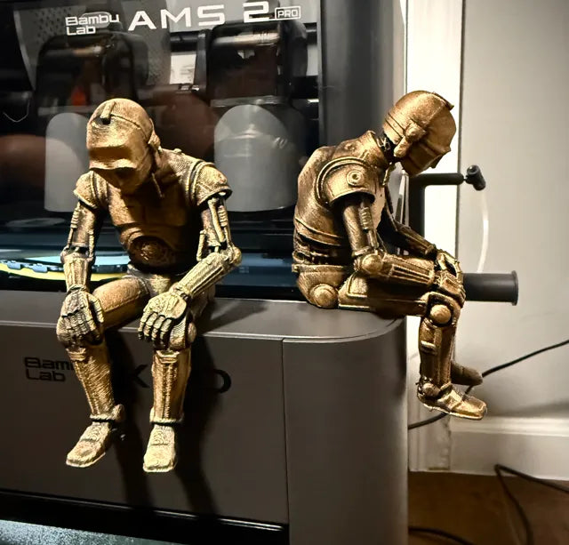 Sad C-3PO Star Wars Figurine sitting on a ledge!