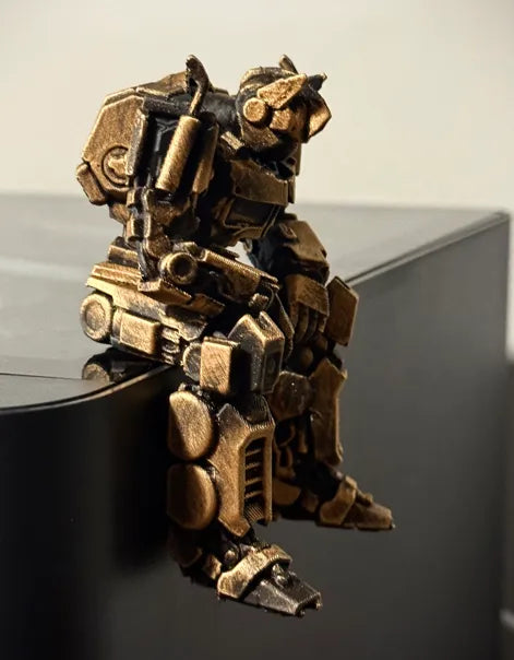 Sad Optimus Prime sitting on a ledge figurine!