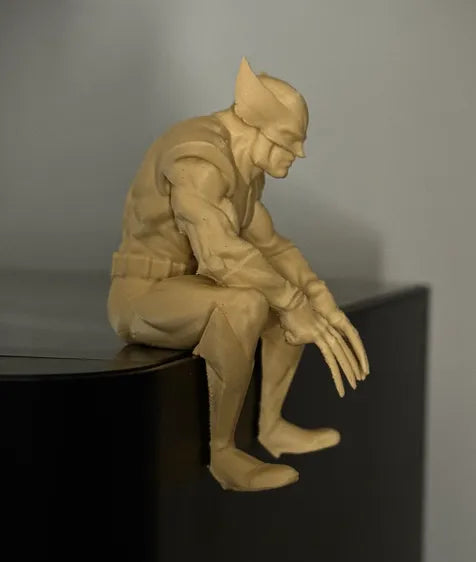 Sad Wolverine sitting on a ledge figurine!