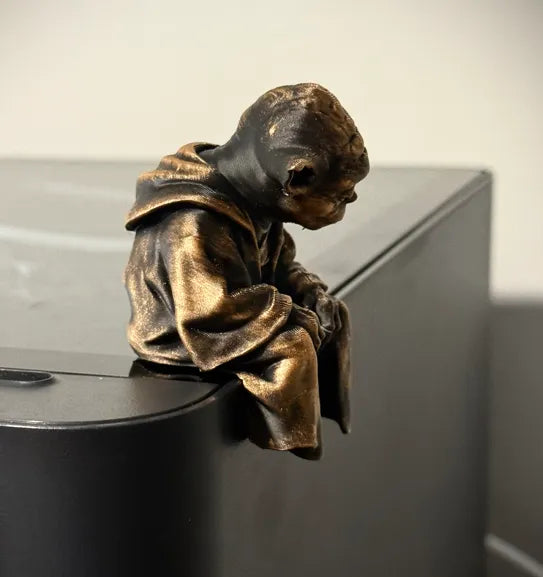 Sad Yoda Figurine on a Ledge!
